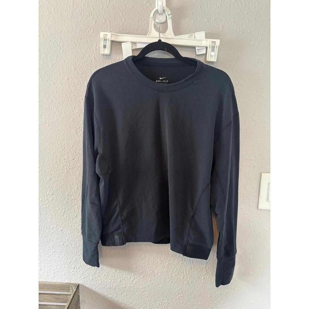 Nike Dri Fit very dark grey long sleeve with logo band size M loose fit. Some we